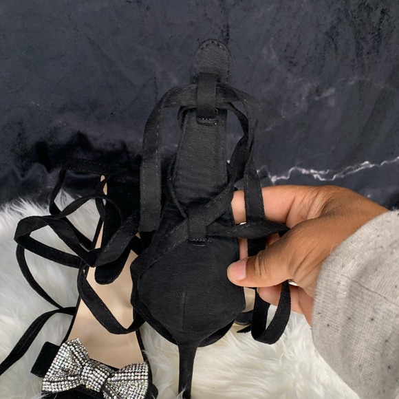 Black wrap around heels with glittery bow on top. - Picture 4 of 8